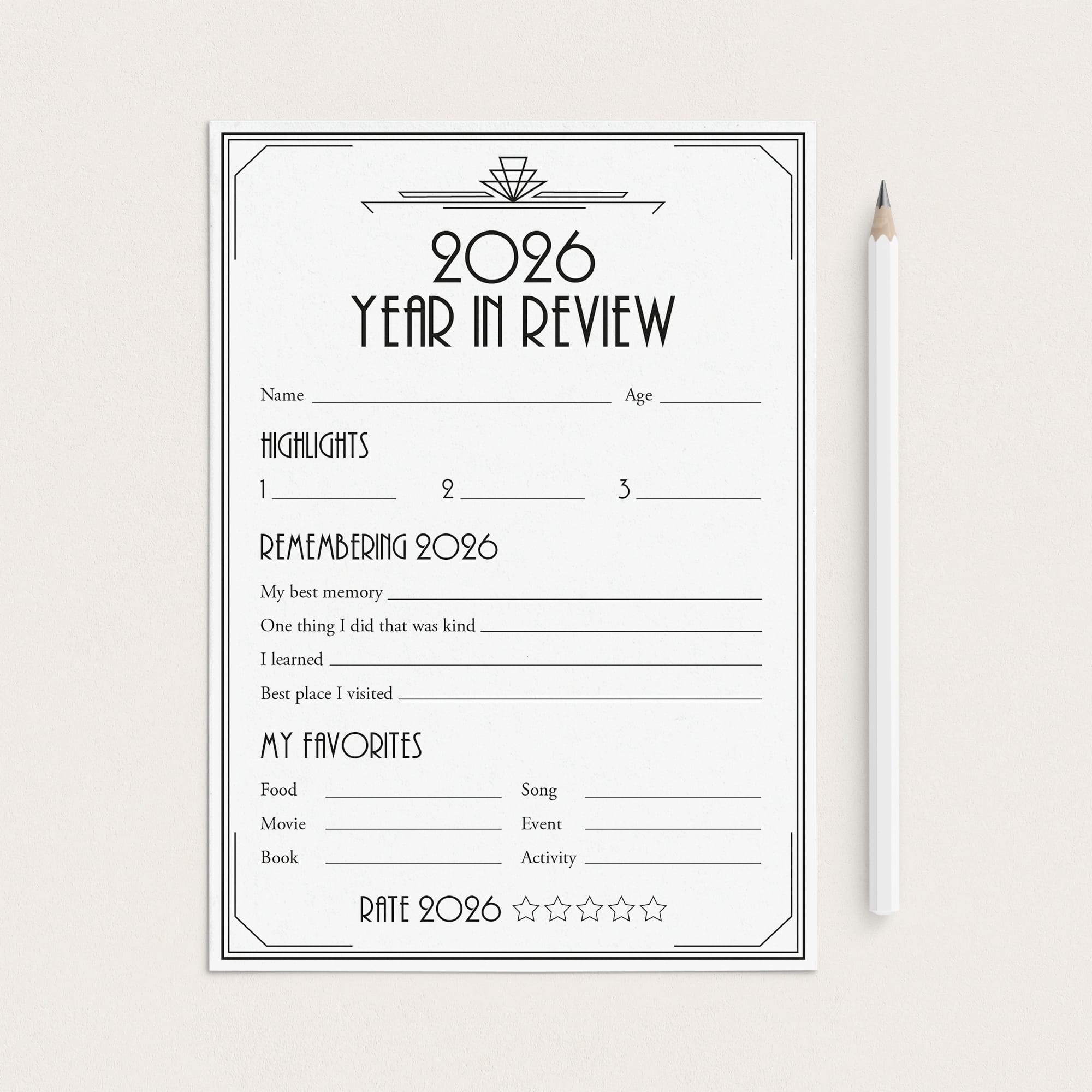 A 2026 Year in Review reflection worksheet with black text and lines on a white sheet, displayed on a light beige background next to a white pencil.