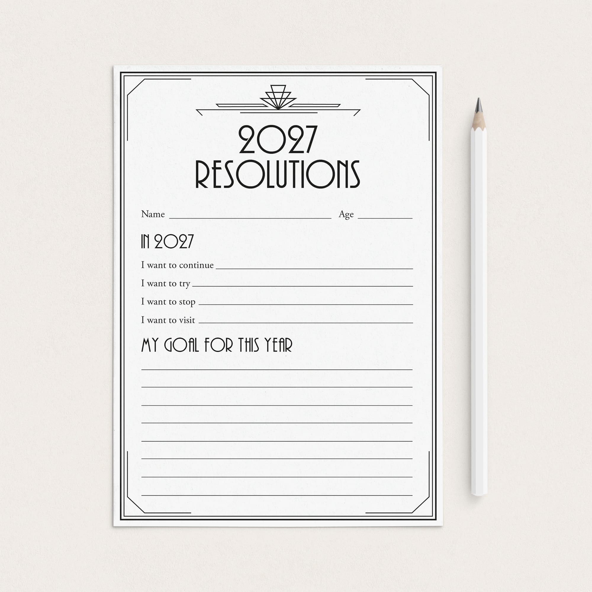 A black and white 2027 resolutions planner pad with lined writing space, shown on a light beige background next to a white pencil.