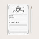 A black and white 2027 resolutions planner pad with lined writing space, shown on a light beige background next to a white pencil.
