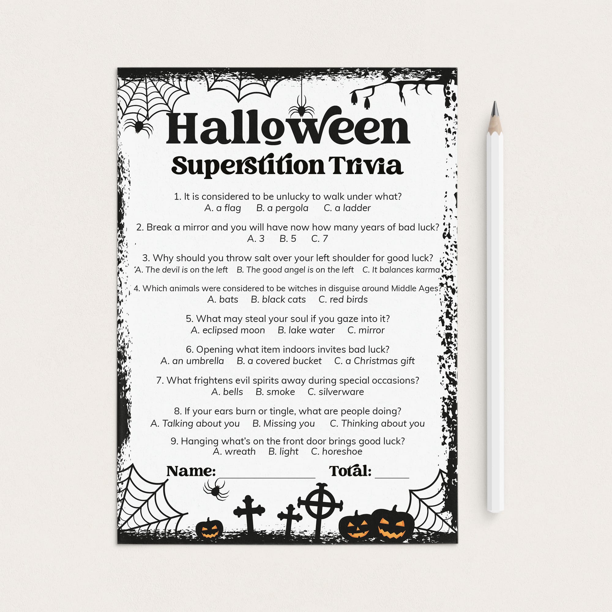 A Halloween superstition trivia worksheet with black text and spider-themed borders, shown on a white background next to a white pencil.