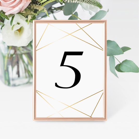 Gold geometric table decorations by LittleSizzle