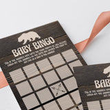 Dark wood background and little brown baby bear baby shower games by LittleSizzle
