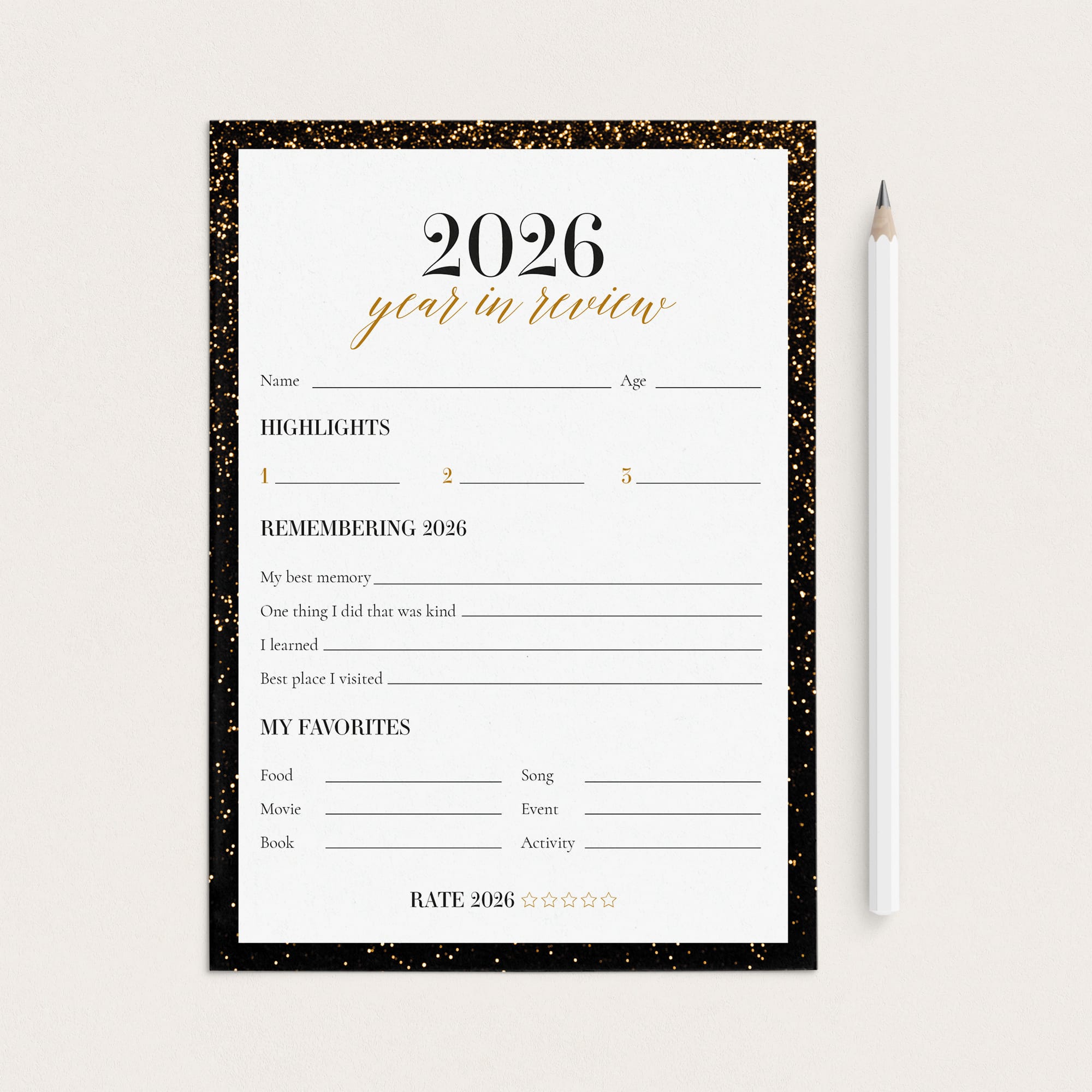 A 2026 year in review planner page with a black glitter border, shown on a light beige background next to a white pencil.
