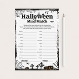 A printable Halloween-themed worksheet card titled 'Halloween Mind Match' with black spiderwebs, bats, pumpkins, and fill-in lines on a white background, shown next to a white pencil on a light neutral surface.