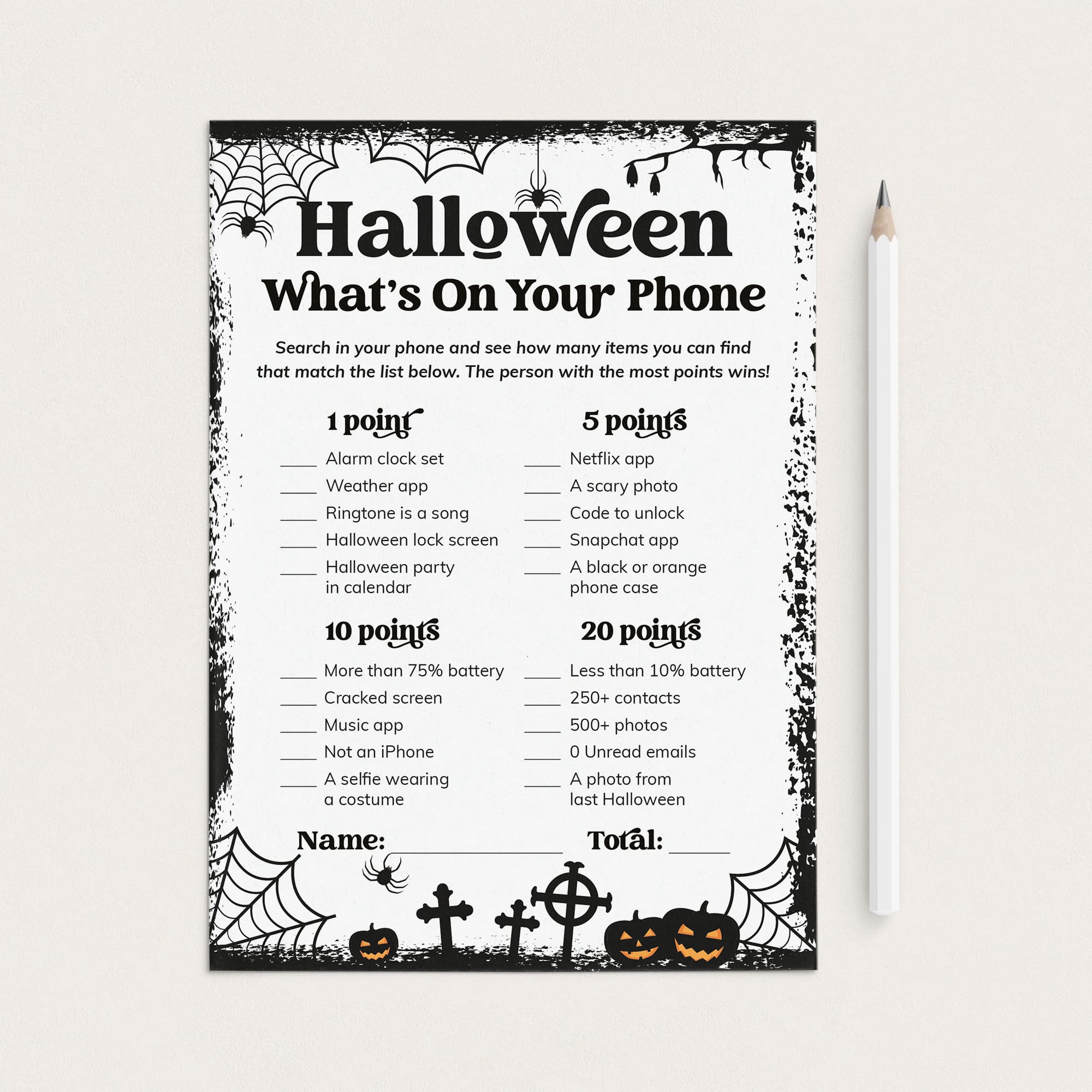 A Halloween-themed phone trivia worksheet with black text and spooky spiderweb, cobwebs, tombstones, and jack-o'-lantern illustrations on a white page, shown on a light beige background with a white pencil beside it.