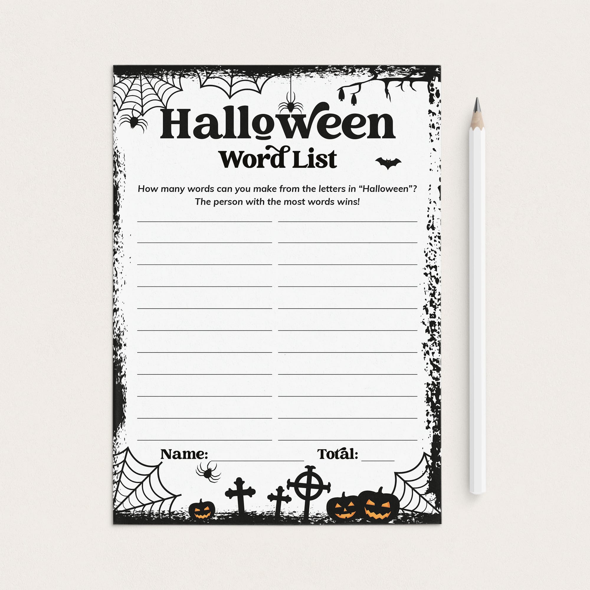 A Halloween-themed word list worksheet with black spiderwebs, bats, pumpkins, and tombstone illustrations on a white page, shown on a light beige background next to a white pencil.