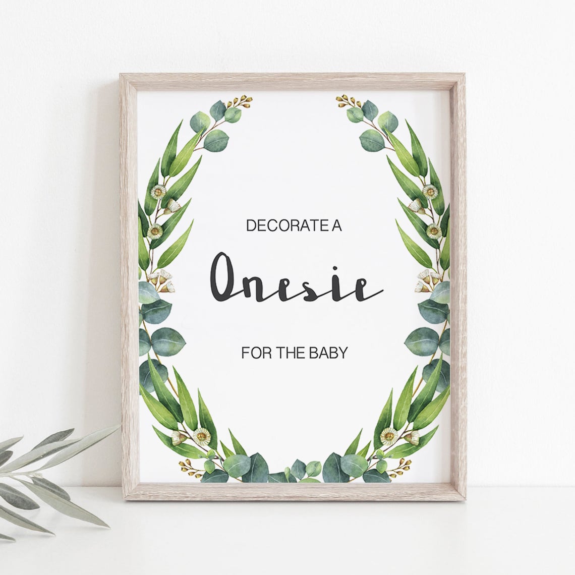 Watercolor leaves decorate a onesie station sign printable by LittleSizzle